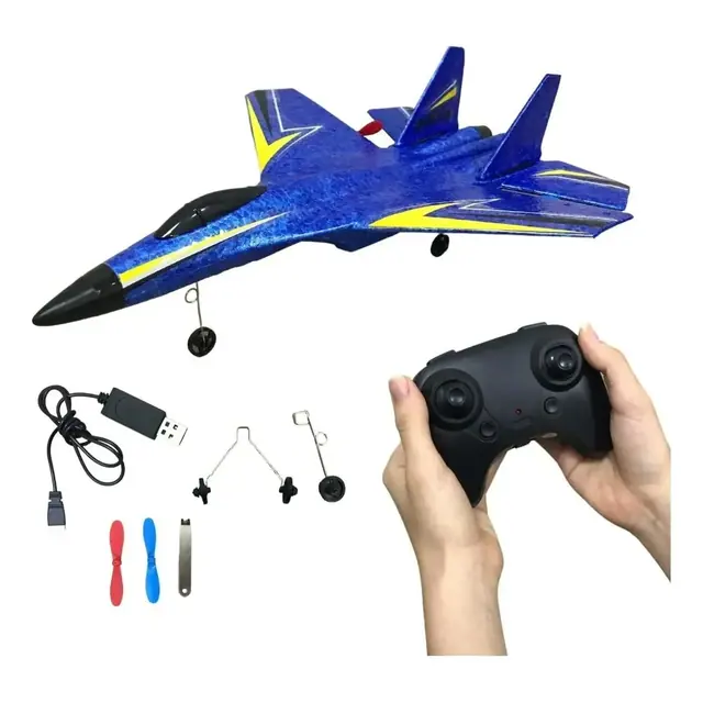 Avión teledirigido azul con su mando, cable USB, hélices de repuesto y ruedas
